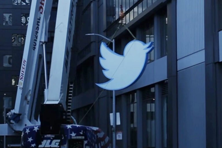 A crane removing the sign from Twitter's HQ.