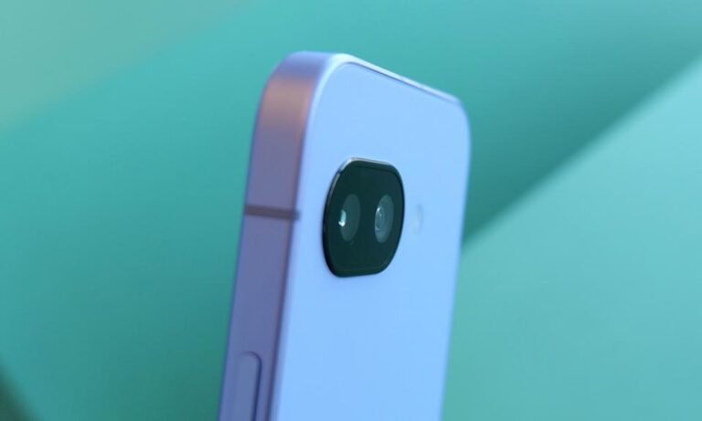 Angled view of the back of the Pixel 9a phone, showing its camera lens.